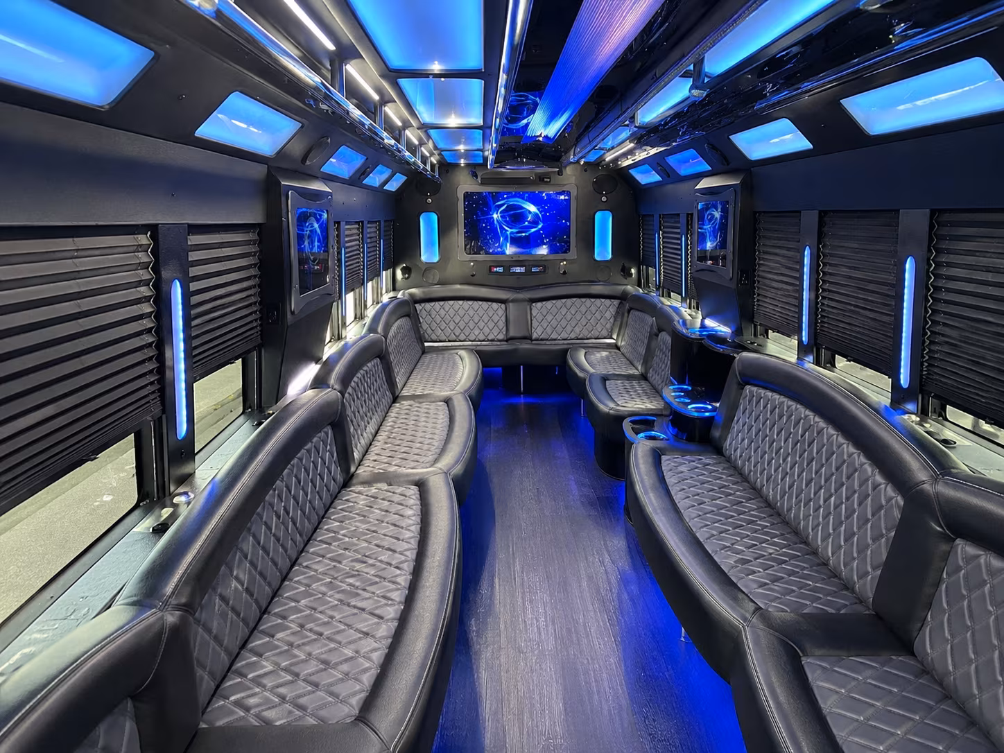 Friends laughing during a party bus celebration in Overland Park